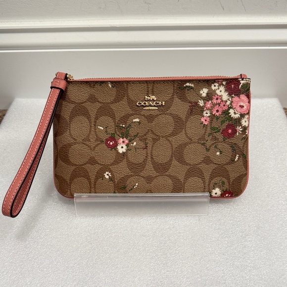 Coach Handbags - Coach Corner Zip Wristlet In Signature Canvas With Floral Print